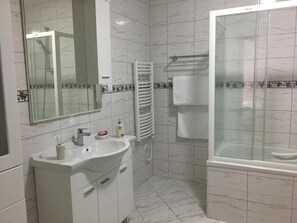 Shower, hair dryer, towels, soap