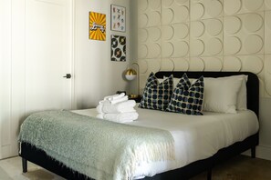 1 bedroom, desk, iron/ironing board, travel crib