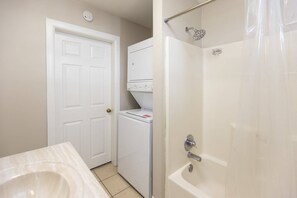 Bathtub, hair dryer, towels