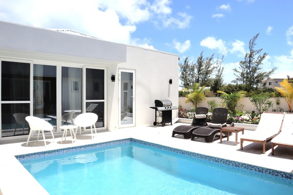 Swimming pool, patio, sun loungers and garden