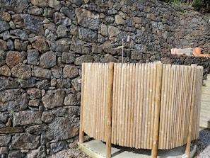 A stone wall with a wooden fence.