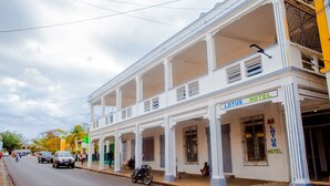 A two-story building with a sign reading "Lotus Hotel." - LOTUS HOTEL DIEGO (Antsiranana)