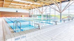 An indoor swimming pool with a wooden ceiling and tiled floor, marked with 'PROF 1.95m'. - Rural lodge with garden and children's play area (Saint-Romain-en-Jarez)
