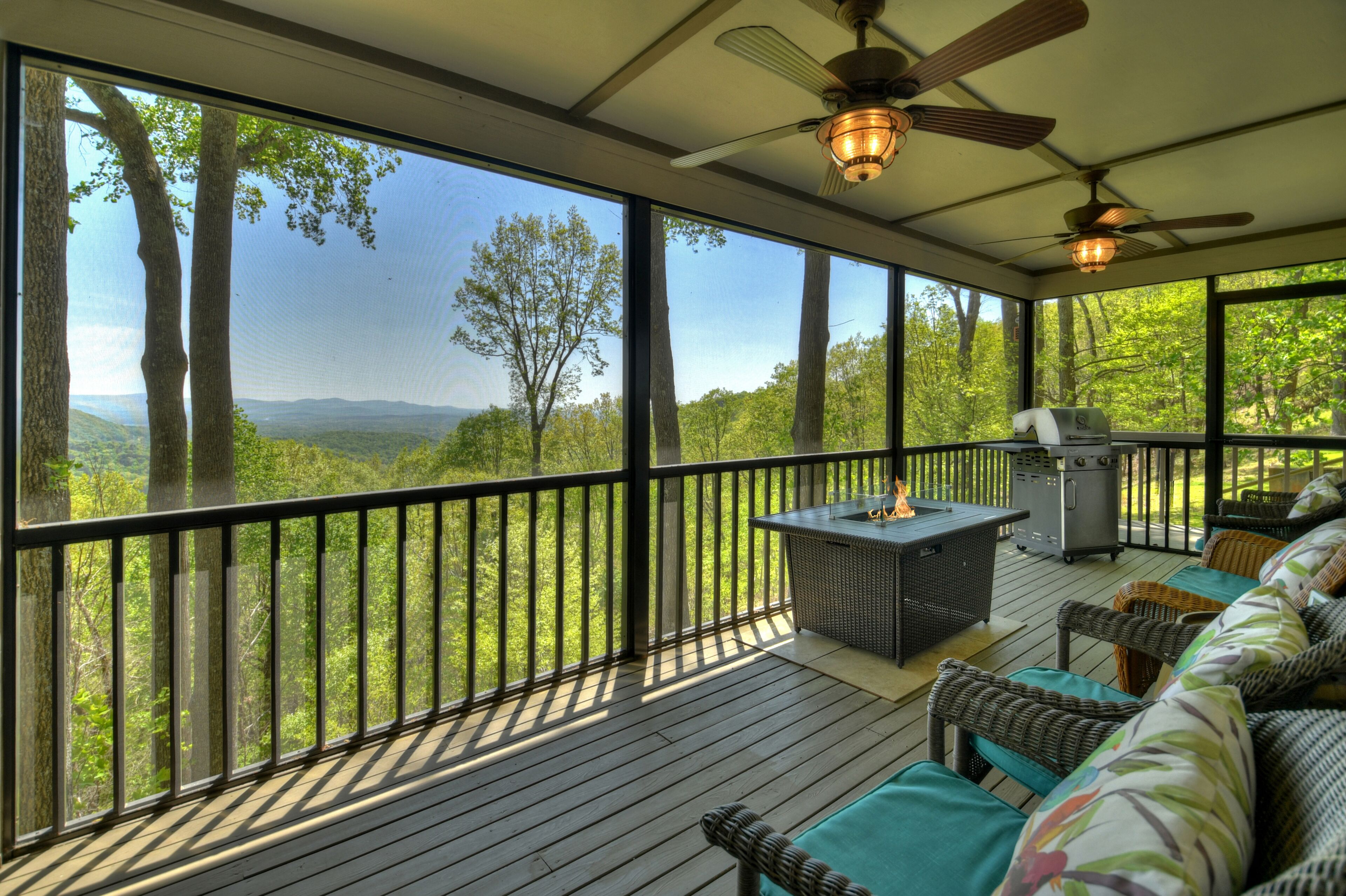 Dancing Bear is pet friendly with a magnificent view of the North GA Mountains, plus a hot tub and large screened porch. WiFi