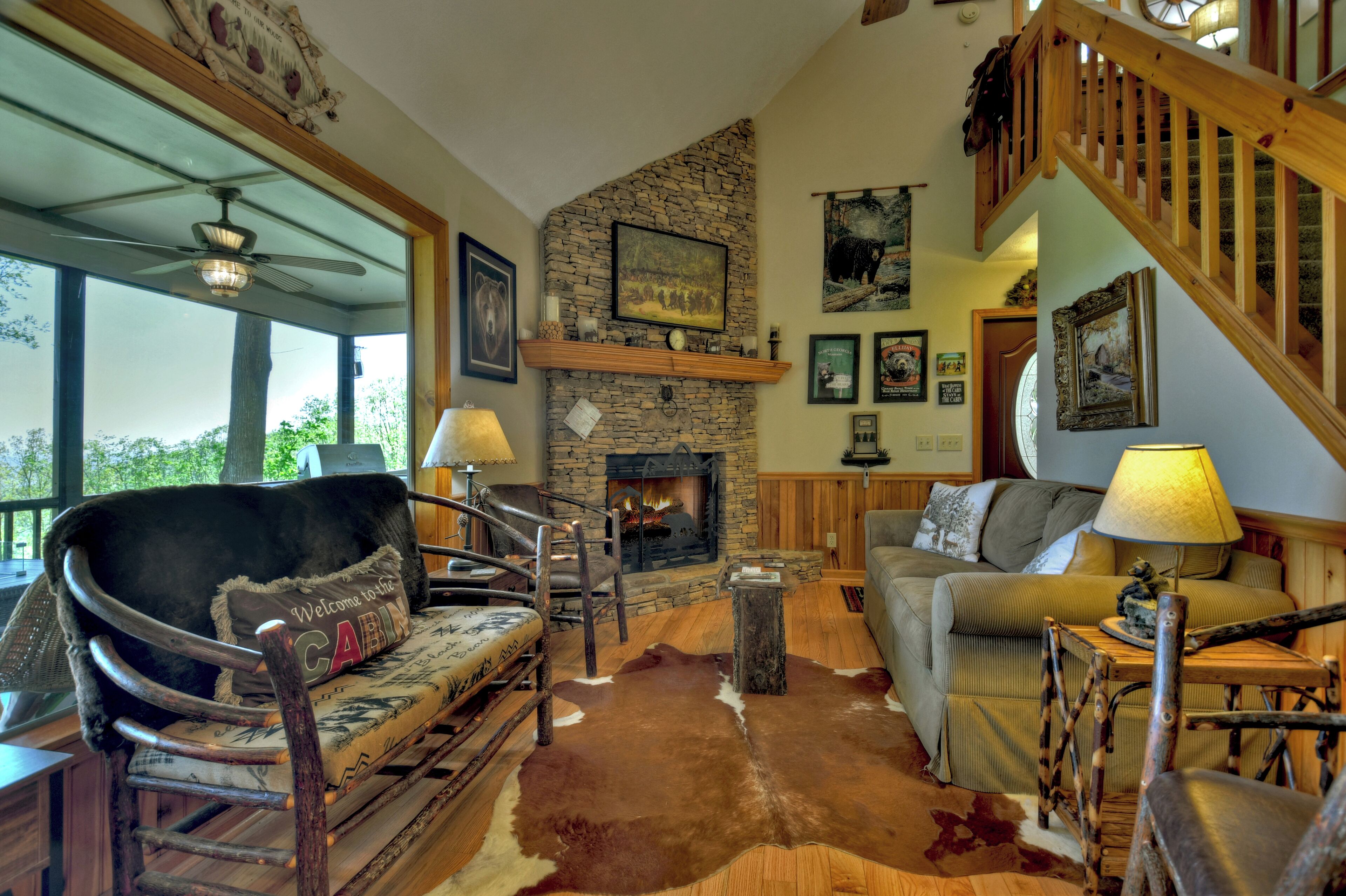 Dancing Bear is pet friendly with a magnificent view of the North GA Mountains, plus a hot tub and large screened porch. WiFi