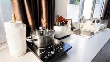 Mini-fridge, stovetop, electric kettle, rice cooker