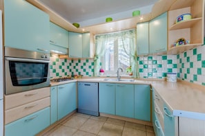 Villa | Private kitchen | Fridge, microwave, oven, stovetop