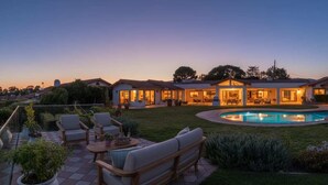 A residential property with a swimming pool, outdoor seating, and a well-lit patio area. - Stunning Santa Barbara Estate (Santa Barbara)