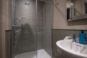 Combined shower/tub, hair dryer, towels, toilet paper