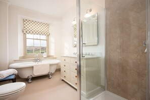 Combined shower/tub, hair dryer, towels, toilet paper