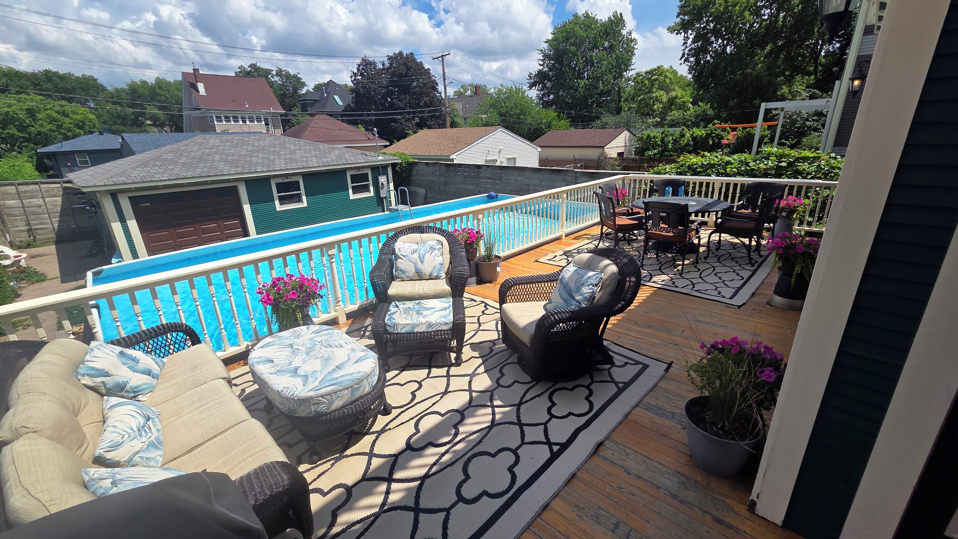 Rear deck, dining table, seating, grill, pool