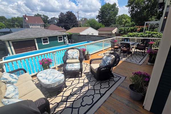 Rear deck, dining table, seating, grill, pool