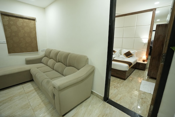 Family Suite | Living area | 32-inch LED TV with satellite channels