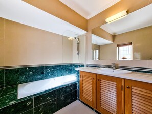Bathtub, hair dryer, towels