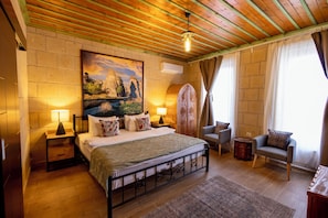 Deluxe Room, 1 Bedroom | Minibar, in-room safe, individually decorated, individually furnished
