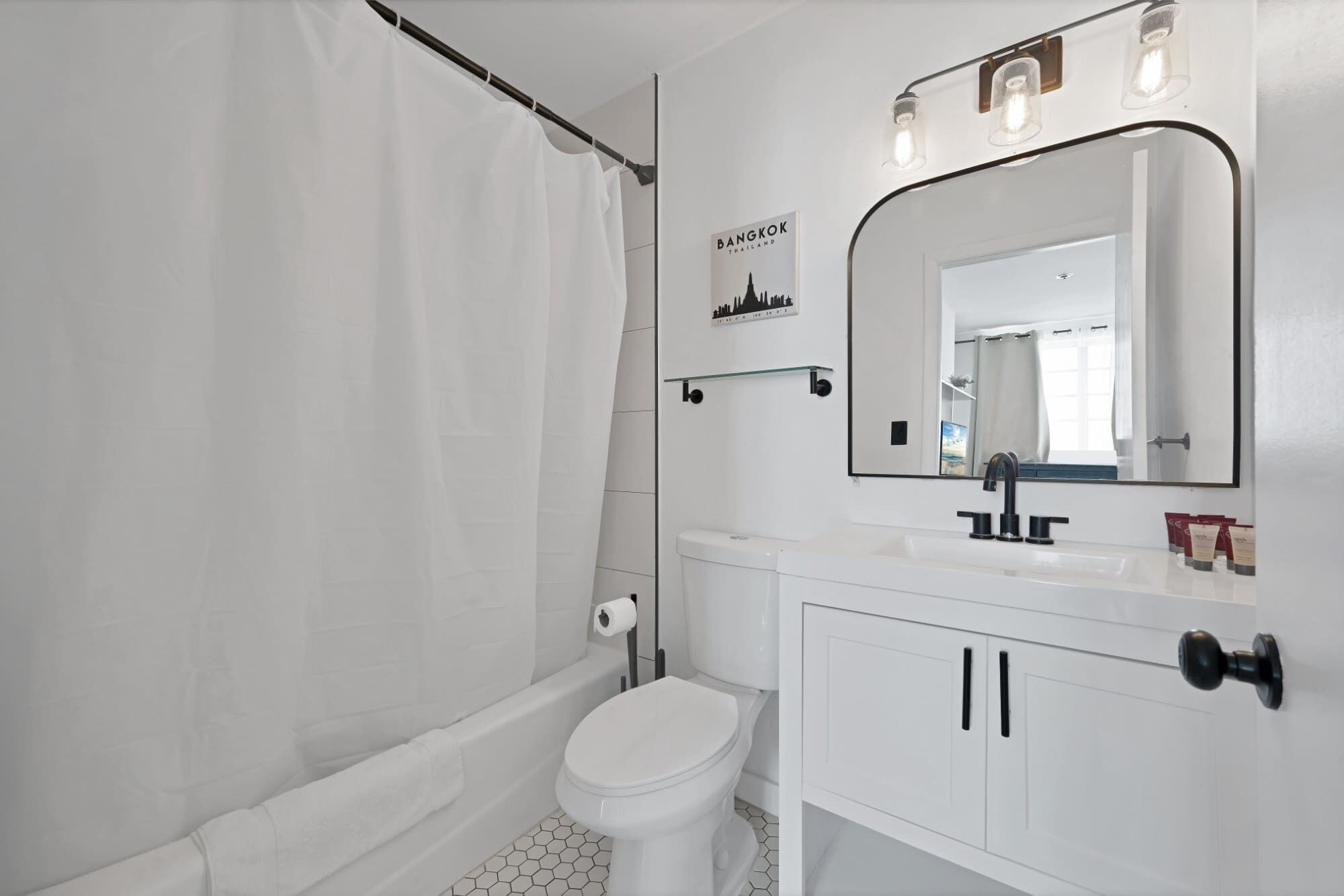 Bathtub, hair dryer, towels, soap