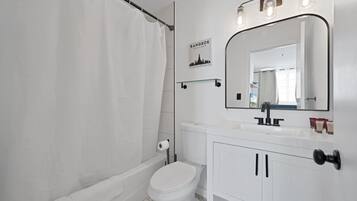 Bathtub, hair dryer, towels, soap