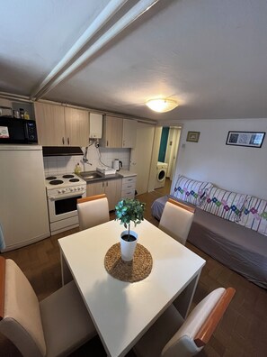 Apartment 1 | Private kitchen | Full-sized fridge, oven, stovetop, electric kettle