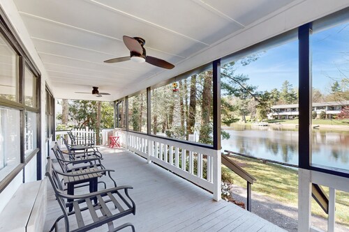 Dog-friendly lakefront condo with pool, canoes, & WiFi - in a perfect location