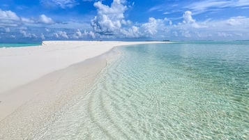 Beach nearby, white sand, free beach shuttle, beach umbrellas