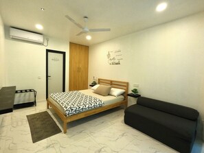 Deluxe kamer, Meerdere bedden, uitzicht op tuin, aan tuin | 4 slaapkamers, gratis wifi, beddengoed