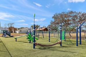 Children's area - Beautiful Summer Home, exceptionally clean, great outdoor space with fire pit! (Port Orange)