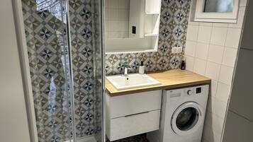 Shower, hair dryer, towels, soap