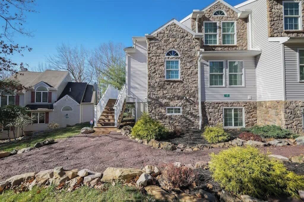 Front Exterior of Home with Driveway & Landscaping