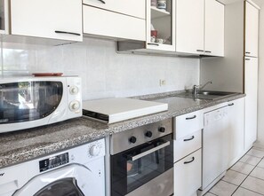 Fridge, oven, dishwasher, dining tables