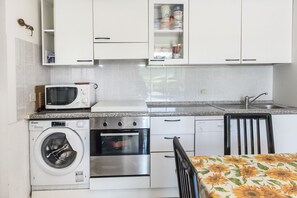 Fridge, oven, dishwasher, dining tables