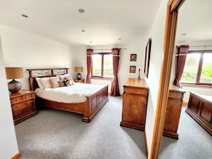 Desk, laptop workspace, travel cot, bed sheets