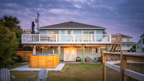 A two-story house with a balcony, a hot tub, and a deck. - Swim Spa with River Views - Pet friendly, Private Dock, Marsh Views - On Beach Time (Folly Beach)