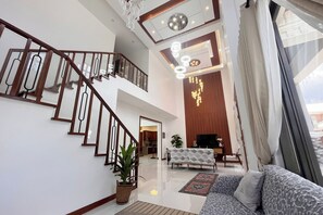 3 Bedroom Villa | Living area | 32-inch TV with cable channels - Torres Farm Resort powered by Cocotel (Naic)