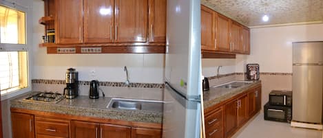 Fridge, stovetop, coffee/tea maker