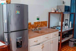 Fridge, microwave, stovetop, cookware/dishes/utensils