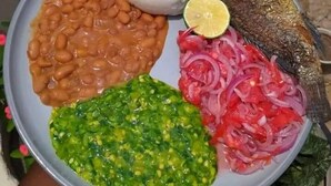 A plate with beans, fish, and a lime slice. - Tanzanin Eco Home & Camp (Arusha)