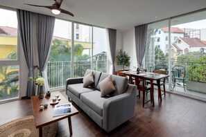Apartamento luxo | Área de estar | TV 49 polegadas com canais digitais, Netflix, filmes pagos
