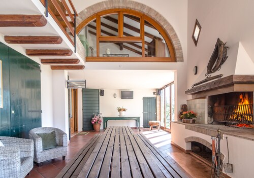 Villa with swimming pool surrounded by greenery