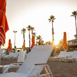 On the beach, sun loungers, beach umbrellas, beach bar
