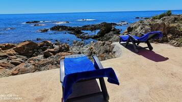 On the beach, sun loungers
