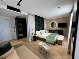 Deluxe Triple Room, 1 King Bed with Sofa bed, Non Smoking, Sea View | Minibar, in-room safe, desk, laptop workspace