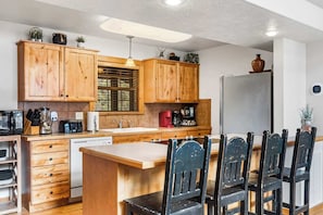 Cabin, Multiple Beds, Fireplace (Whispering Creek) | Private kitchen | Coffee/tea maker, dining tables