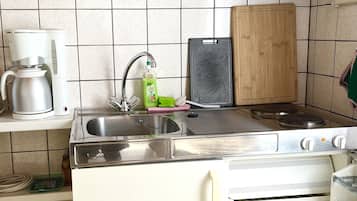 Fridge, electric kettle, toaster, cookware/dishes/utensils