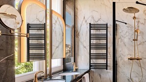 A modern bathroom with a black and white marble floor, a large mirror, a dual sink vanity, and a shower area. - The Crown Krakow Center - Handwritten Collection ACCOR (Kraków)