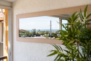 Enjoy a peaceful view of the surrounding neighborhood from this room's window.