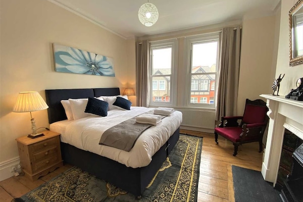 Spacious bedroom with super king bed convertible to 2 singles with original casted iron fireplace