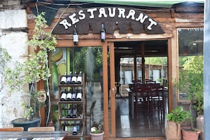 Breakfast, lunch, dinner served; local cuisine