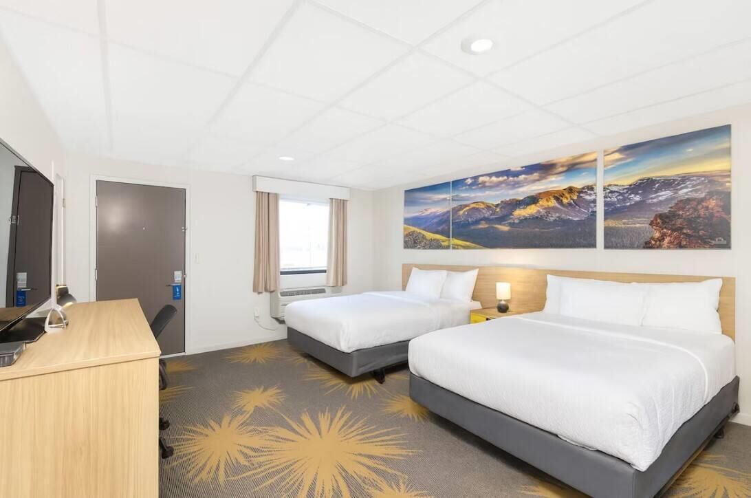 Desk, laptop workspace, iron/ironing board, free cribs/infant beds