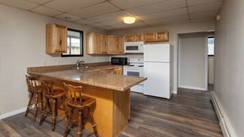 Suite, 2 Queen Beds, Non Smoking | Desk, laptop workspace, iron/ironing board, free cribs/infant beds