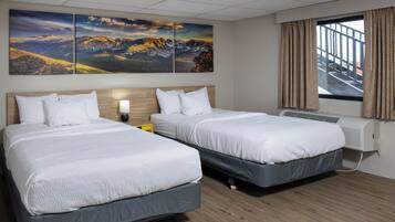 Desk, laptop workspace, iron/ironing board, free cribs/infant beds